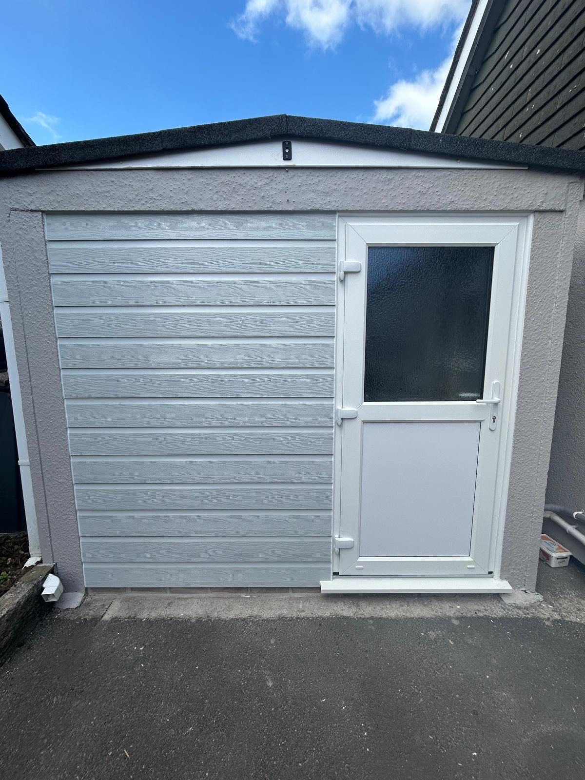St Austell Bay Plastics - UPVC Cladding and UPVC door garage incorperation